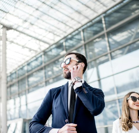 Business woman with security outdoors