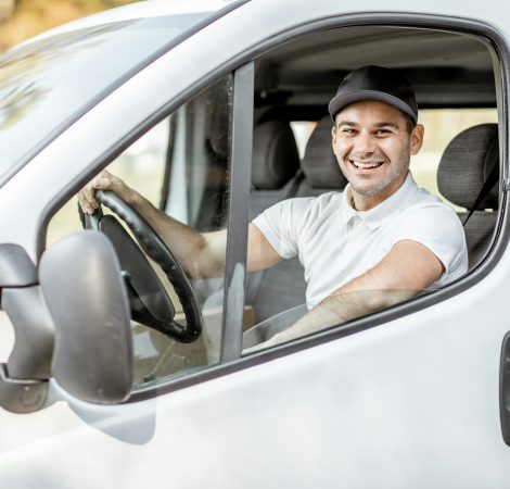 Portrait of delivery driver in the car